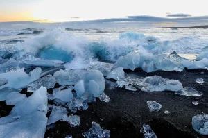 Pieces of glacial ice on the black sand at Diamond Beach