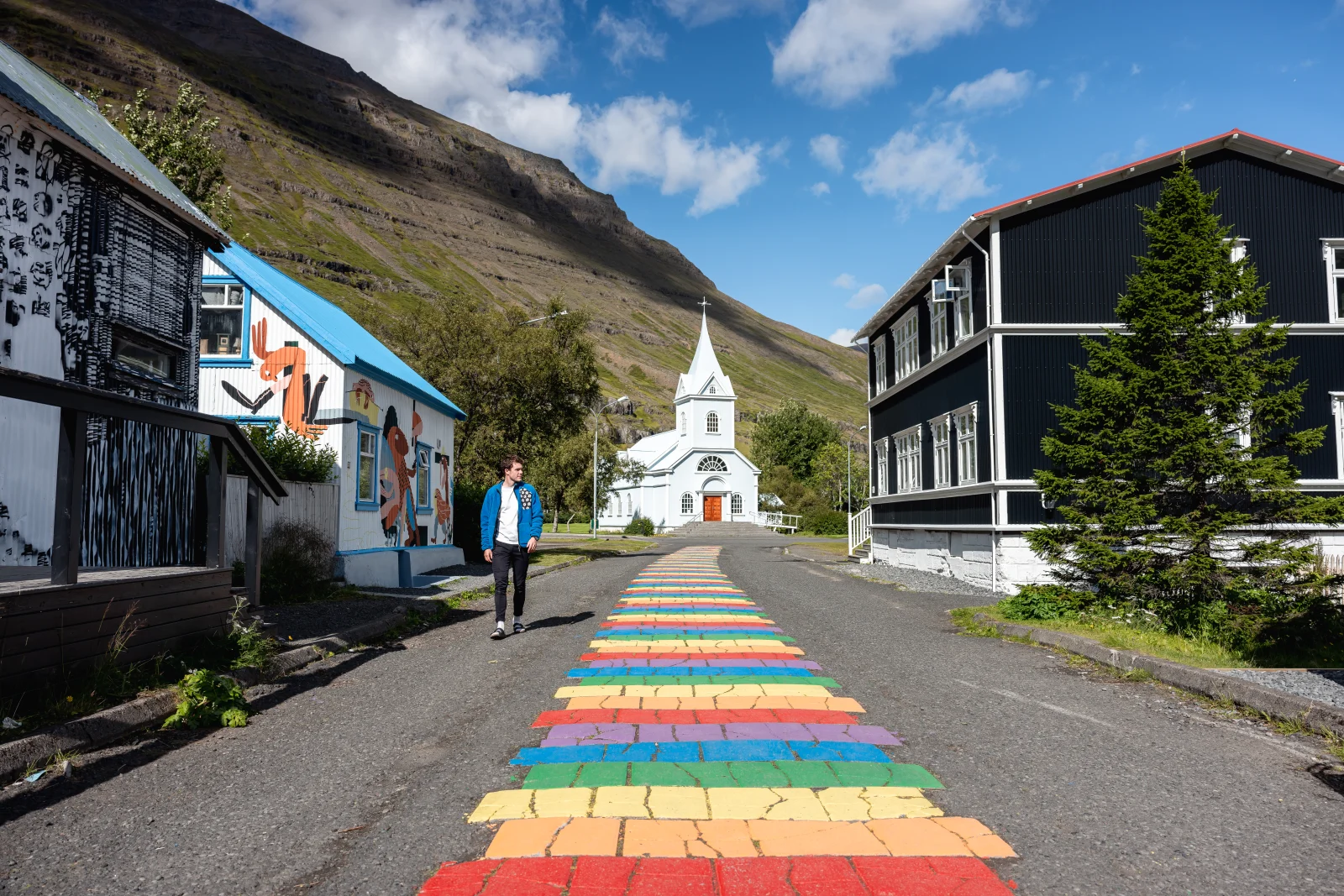Rainbow Street leading towards the church in Seyðisfjörður